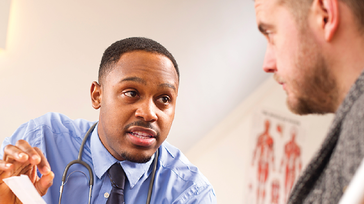 Provider discussing paperwork with patient